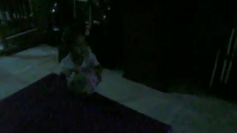 Cute 2 year old girl plays at night