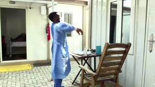 Exhausted Nigerian doctors wait for vaccines