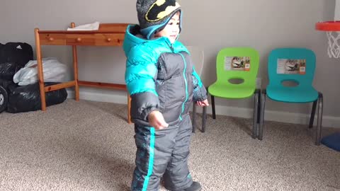 Toddler Tries Out New Snowsuit