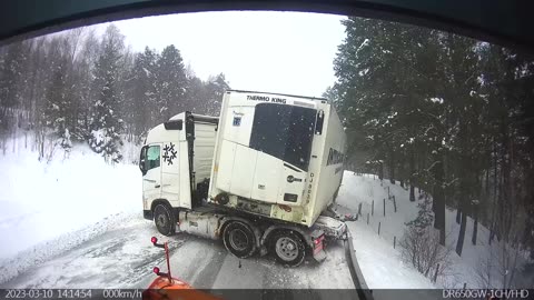 Semi Truck Loses Control On Icy Hill