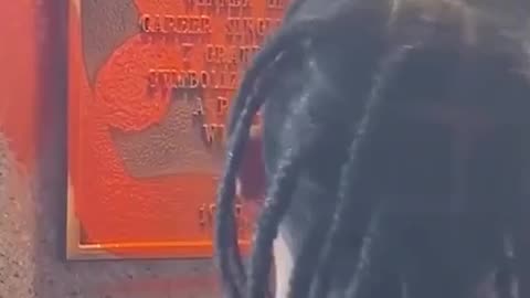 Travis Scott spray painting over John McEnroe‘s plaque why?