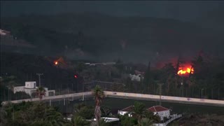 Fires smoulder as lava flows from La Palma volcano