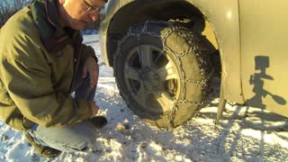 Putting tire chains on and driving across the swamp