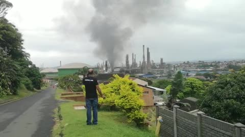 Concern community member speaks after a massive fire is raging at the Engen refinery