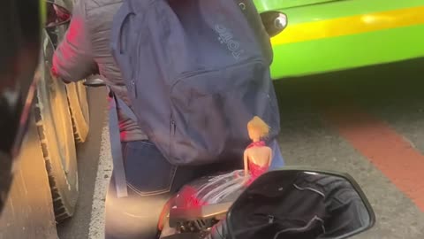 Motorcyclist Gives Barbie a Lift