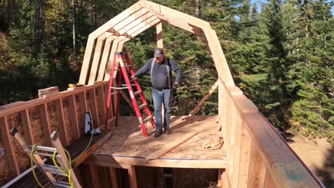 Cabin trusses and roof going on