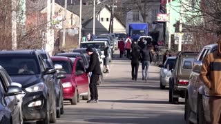 Fleeing war, people cross into Romania from Ukraine