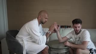 Andrew Tate arm wrestles Adin Ross with two fingers