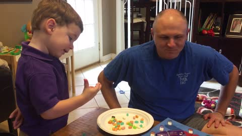 Toddler outsmarts dad at jellybean game