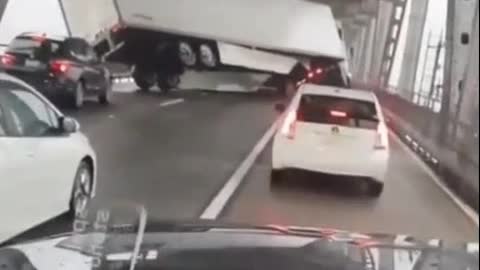 WATCH: Wind gust blow this truck across the bridge