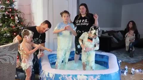 mom lets kids make a pool in living room