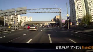 Car Darts Across Two Traffic Lanes