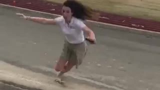 Banana peel thrown at girl she jumps over it and lands on it then slips