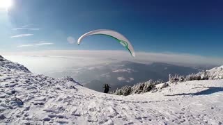 Epic paragliding from above the frozen Carpathian Mountains