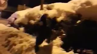 Guy in black sweater running and falling in snow