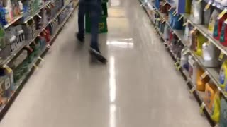 Guy runs into a grocery stand and knocks it down