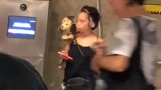Woman black shirt with stuffed toy on shoulder