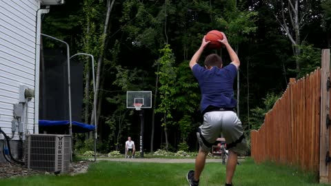 Basketball trick artist hits full court front flip shot