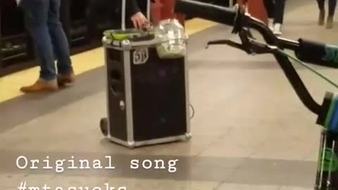Guy sings "mta sucks" song in subway station with speaker box