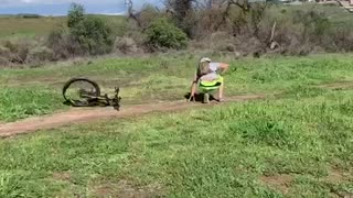 Biker does a jump off ramp and lands on his face