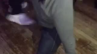 Guy in green shirt does split on dance floor music