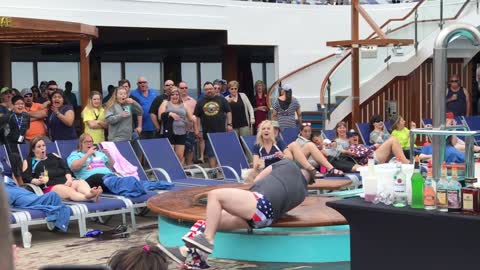 Man Shows Off Dance Moves While Shaking A Cocktail Tumbler On A Cruise