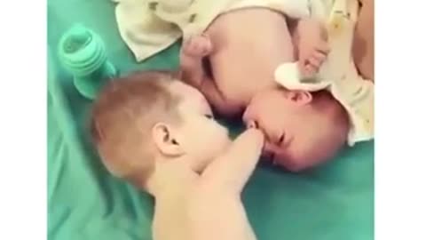 Disabled Toddler Helps Brother