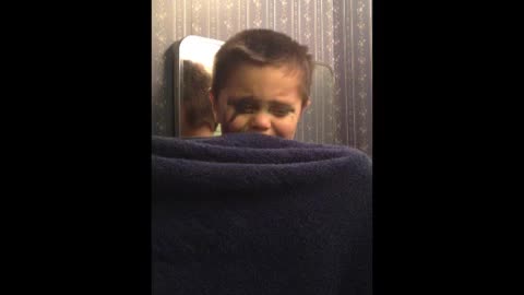 Toddler hides from camera after putting on makeup