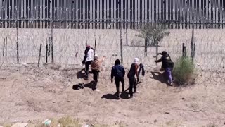 Guards at US-Mexico border pepper-spray migrants