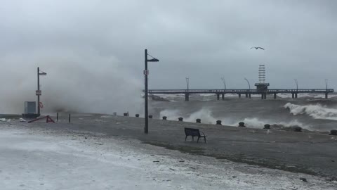 Massive waves pound the shoreline at Spencer Smith Park in Burlington during freezing rain storm