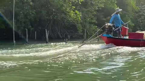 Fisherman on Motorboat