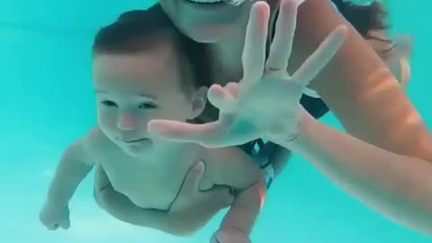 baby learning to swim how cute