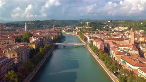 verony taly skyline aerial footage in view of riva and bridge in verona city