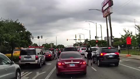 DASHCAM: Chicago Thugs With Automatic Rifle Open Fire In Traffic