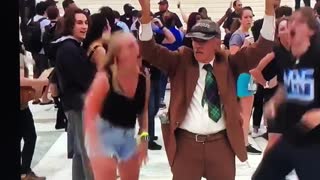 Young Woman Slaps Elderly Man's Sign