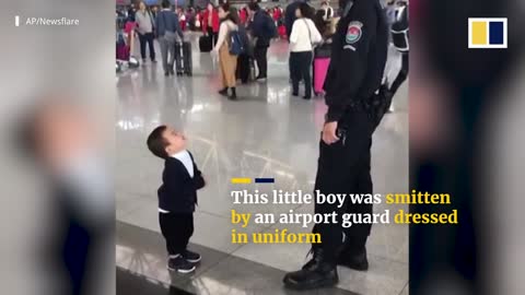 Cute boy wants a hug from secorety guard
