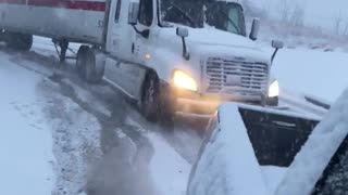 Amazing - Tractor Trailer pulled out of snow by Pickup Truck