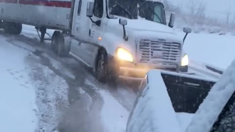 Amazing - Tractor Trailer pulled out of snow by Pickup Truck