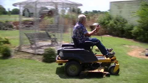 Man Twirls Baton while Mowing! Viral Video!