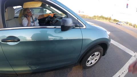 Cyclist vs. Driver on Cell Phone Road Rage