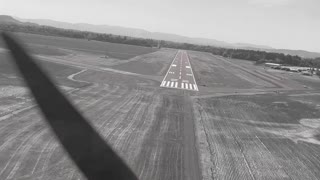 landing in black and white... and red