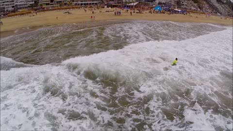 Surfing in Renaca beach in Chile