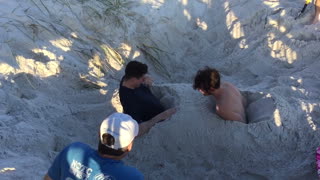 Two Guys Epically Fail When They Bash Into Each Other During Sand Race