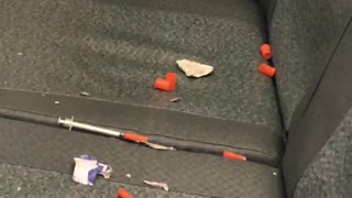 Pile of used needles left on train seats