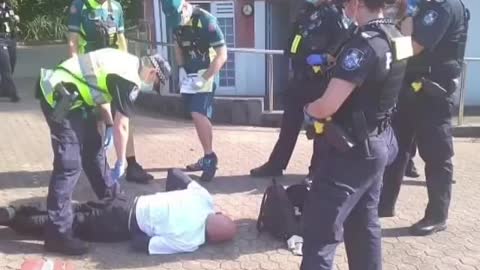 Elderly man collapses to ground after arrest for 'failing to wear a face mask'
