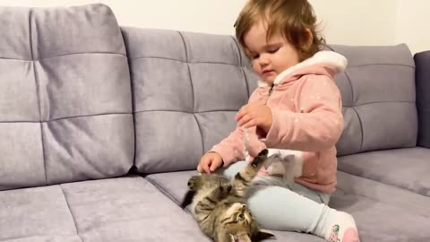 cute baby meets new baby kitten for the first time!