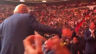 UFC crowd breaks out in USA! USA! USA! chant as Trump rises and waves at the area