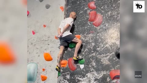 Rock climber impressively scaled the wall with hands behind his back (United States Of America)