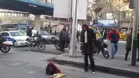 Girl playing music in street of Tehran