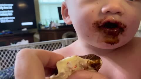 Twin A gets chocolate for first time